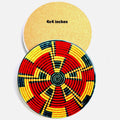 A round woven basket-style coaster or mat shown from two angles on a plain white background. The front view shows a red, yellow, and black geometric woven pattern, and the back view is a plain tan surface with the text '4x4 inches' printed on it.