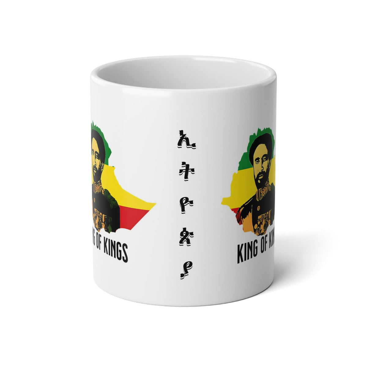 A white ceramic mug featuring a graphic print of a bearded man in a Rastafarian-style portrait with green, yellow, and red elements, alongside the text 'King of Kings' and stylized vertical lettering.