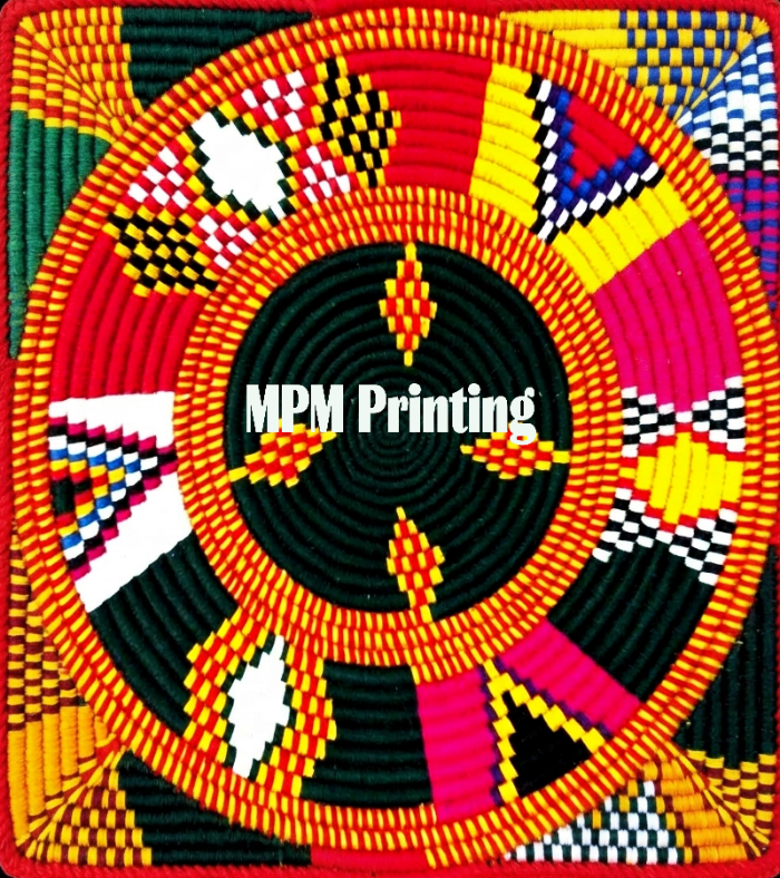 A colorful circular textile or rug design with concentric rings and geometric patterns in red, yellow, black, orange, pink, white, and blue. The center reads 'MPM Printing' in white text.
