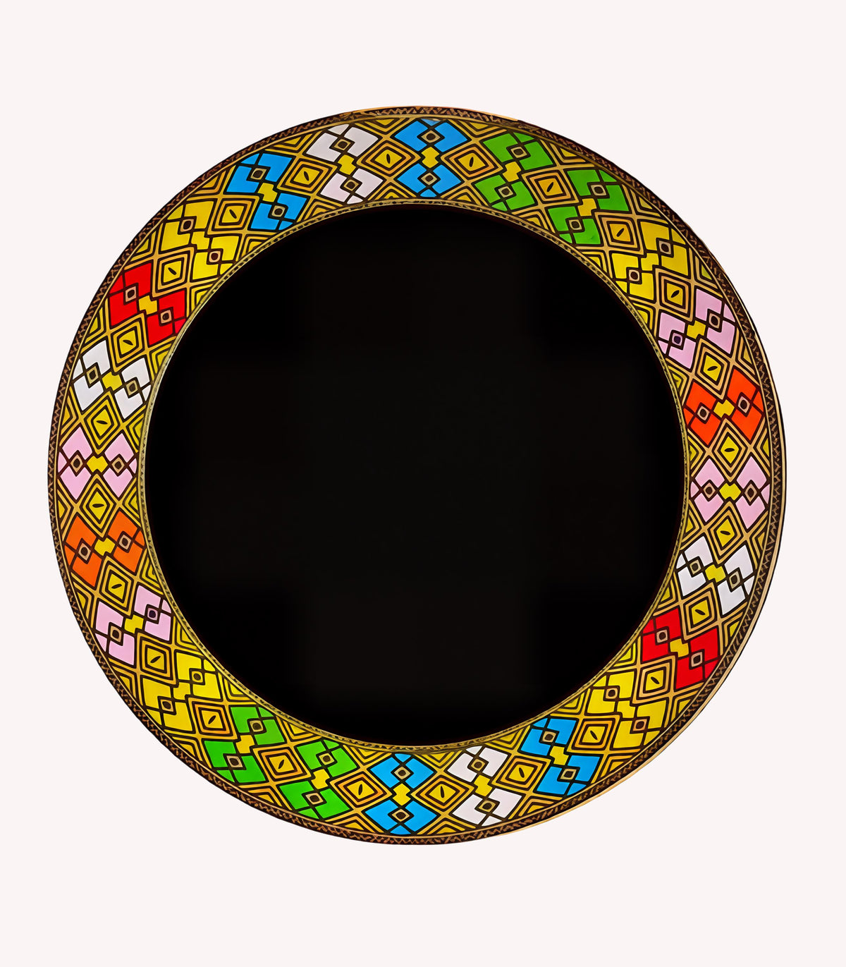 A circular decorative plate or tray with a wide rim featuring a colorful geometric pattern in yellow, green, blue, red, pink, and white, surrounding a solid black center, shown on a light gray background.