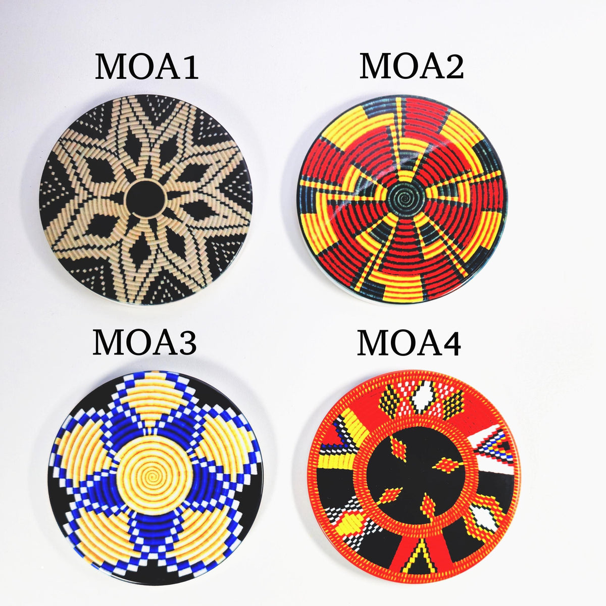 Four round woven decorative baskets shown on a white background, labeled MOA1 through MOA4. Each basket has a different geometric pattern in black, beige, red, yellow, and blue.