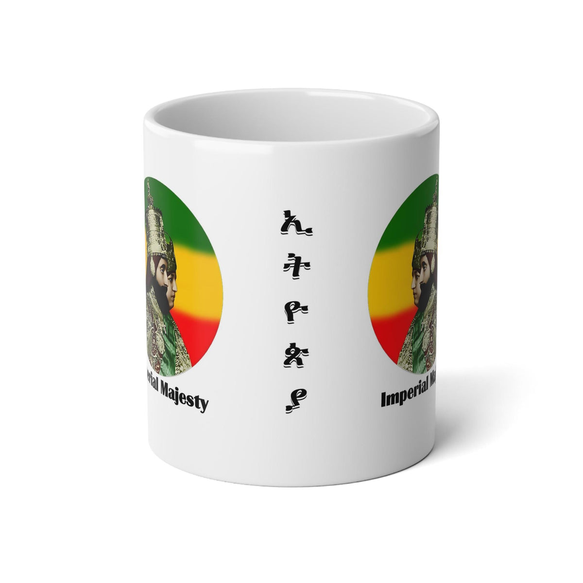 A white ceramic mug featuring a Rastafarian-themed design with a circular green, yellow, and red graphic, vertical black text reading 'KUMPLE', and partial text 'Imperial Majesty' visible on the sides.